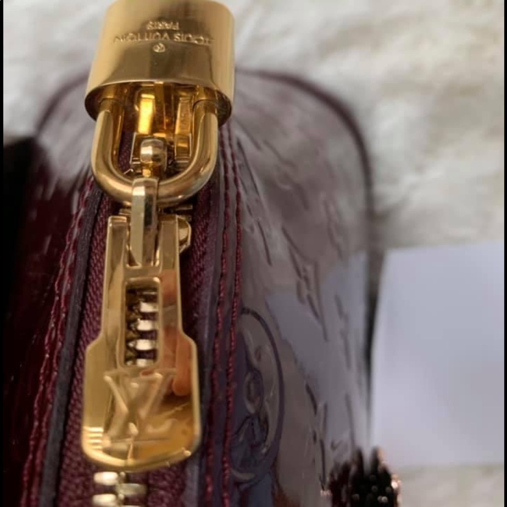 Gently used Louis Vuitton Vernis Alma PM with golden hardware